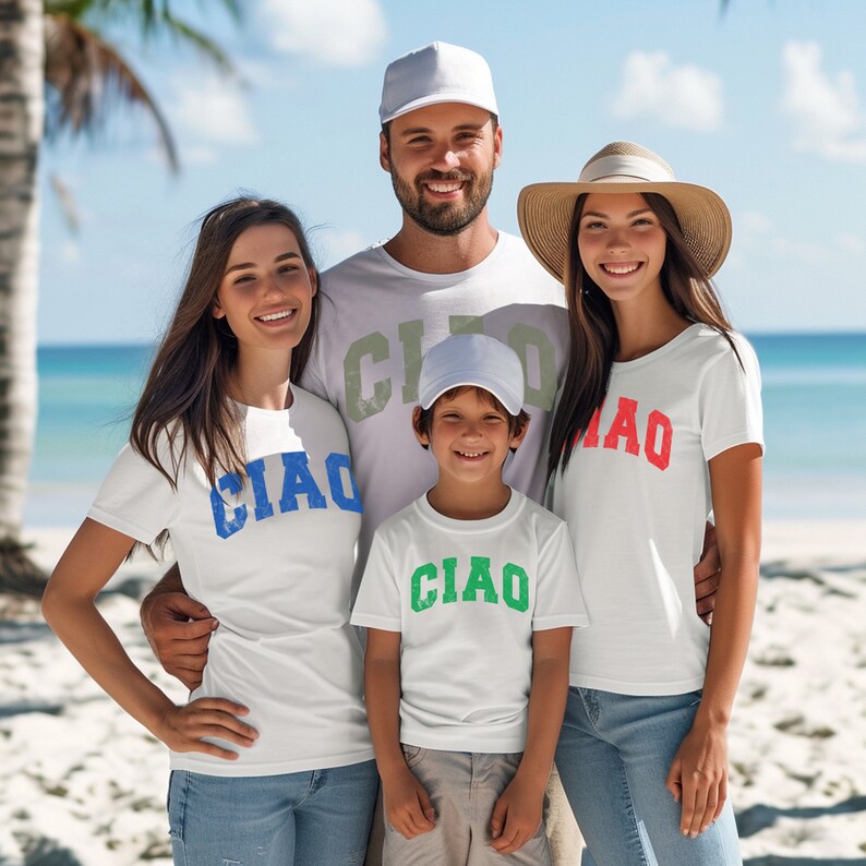 May include: A family of four wearing white t-shirts with the word "CIAO" printed on them in different colors. The shirts are a fun way to show Italian pride or to wear on a vacation to Italy.