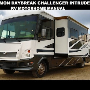 May include: A white and black Damon Daybreak Challenger Intruder RV motorhome with a large awning extended. The motorhome has a black front bumper and a black grill with a chrome emblem.