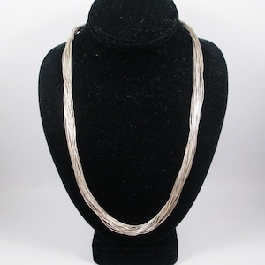 Vintage NAVAJO LIQUID SILVER Necklace.  Tiniest Sterling Beads on 30 strands with Caps Stamped with Rising Sun.  Estate Find.