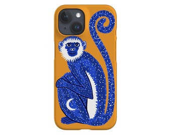 May include: A blue and white monkey phone case with a yellow background. The monkey is sitting down with its tail curled up behind it. The monkey has a white face and a crescent moon on its belly.