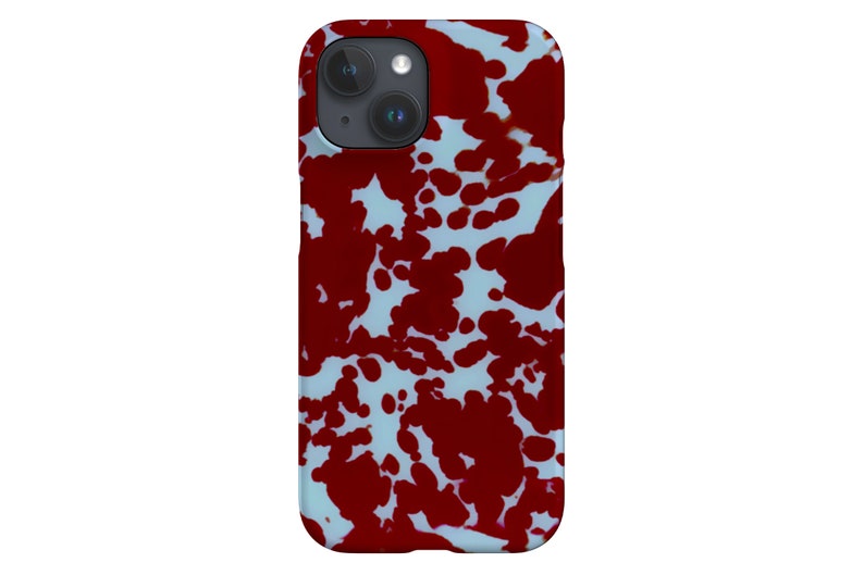 Peut inclure: Une coque de t&eacute;l&eacute;phone iPhone blanche avec un motif de peinture rouge &eacute;clabouss&eacute;e.