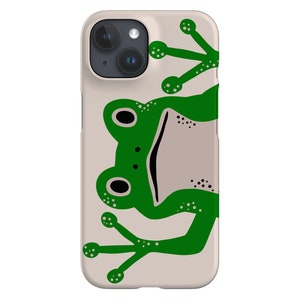 May include: A beige phone case featuring a green frog design. The frog is facing the viewer with its mouth open and eyes closed. The frog's legs are outstretched, with its toes visible.