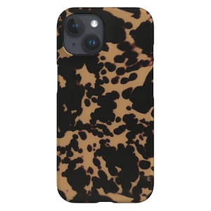 May include: A black and brown tortoiseshell patterned phone case for an iPhone.