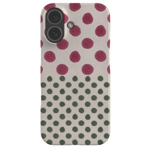 May include: A phone case with a cream-coloured background. The top half features large, maroon polka dots, while the bottom half has smaller, dark green polka dots. The case has a camera cutout.