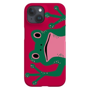 May include: A red phone case with a green frog design. The frog has a pink mouth and belly, with outstretched limbs. The case is designed for a smartphone. The frog illustration is a playful design.