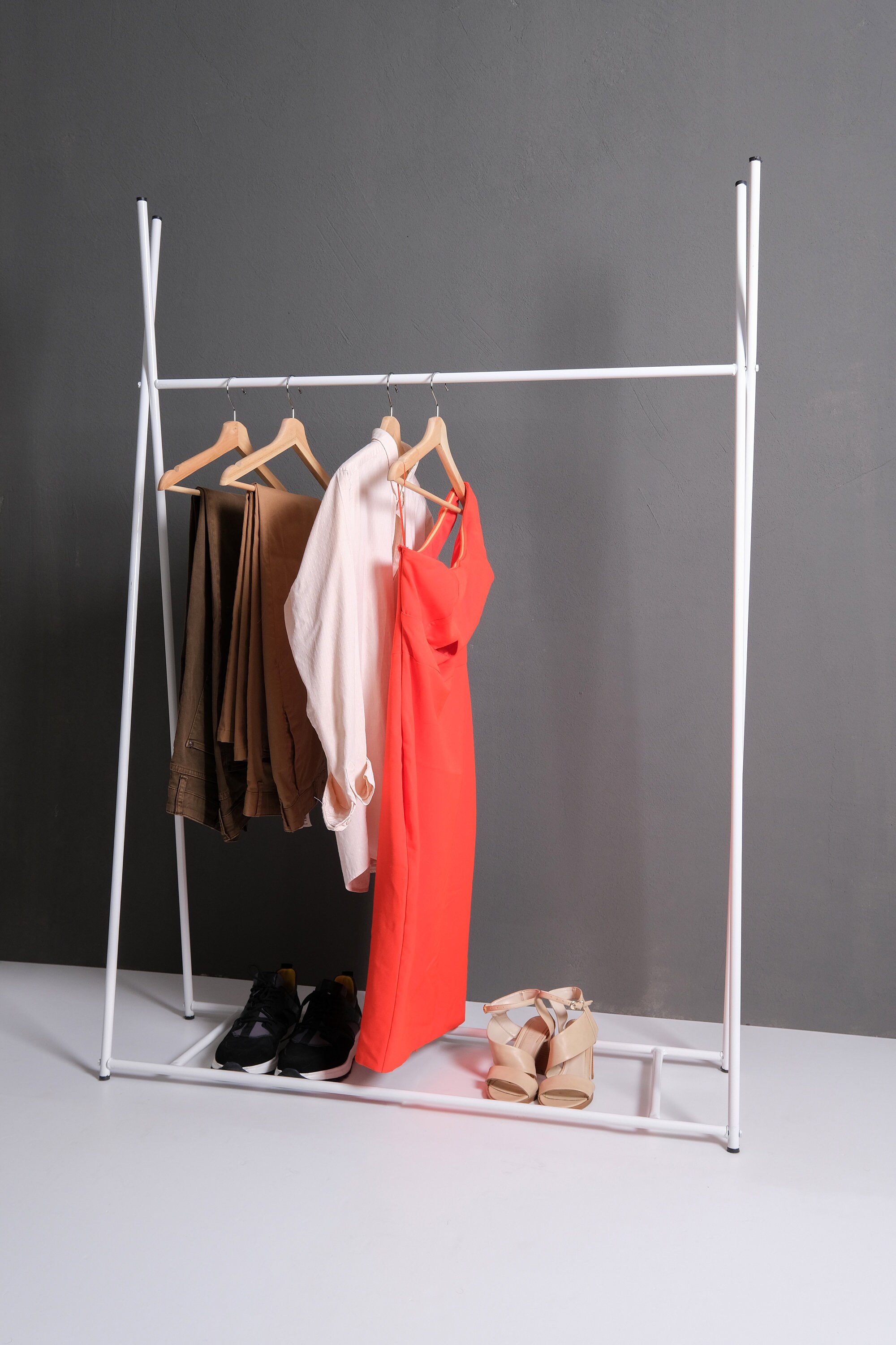 white industrial clothing rack