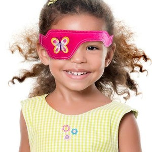May include: A pink eye patch with a butterfly design. The eye patch is made of soft felt and has an adjustable strap.