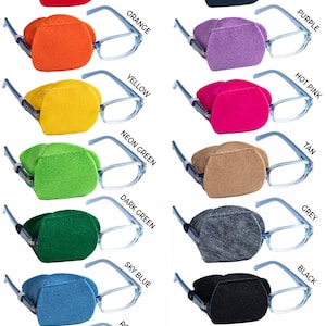 May include: A set of 12 eye patches for glasses in various colors, including red, orange, yellow, green, blue, purple, pink, tan, grey, and black. The patches are made of felt and are designed to cover one eye.