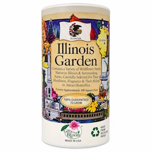 May include: A cylindrical container of Illinois Garden wildflower seeds featuring a colorful collage of state landmarks, a cardinal, and the Illinois state flag. The label text includes "Contains a Variety of Wildflower Seeds" and "100% GUARANTEED TO GROW."