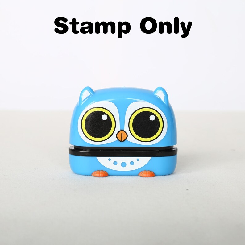 May include: A blue and yellow owl-shaped stamp with large eyes and a black beak. The stamp is made of plastic and has a white belly with black dots.