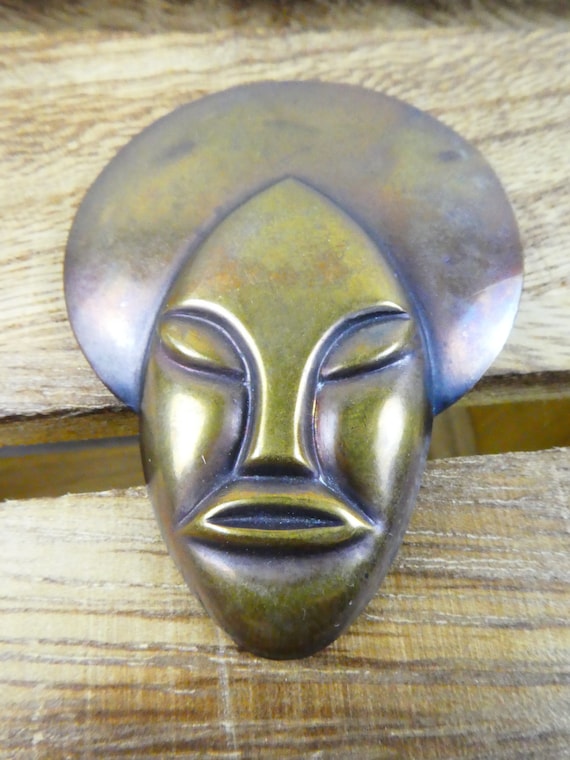 Vintage very unusual Brass Face brooch.