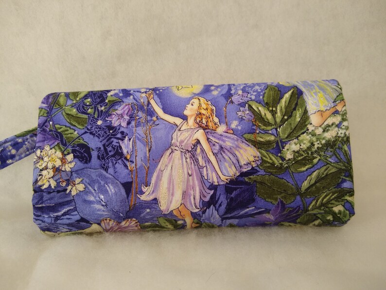 Magical Fairies adorn this accordionexpandable wallet!