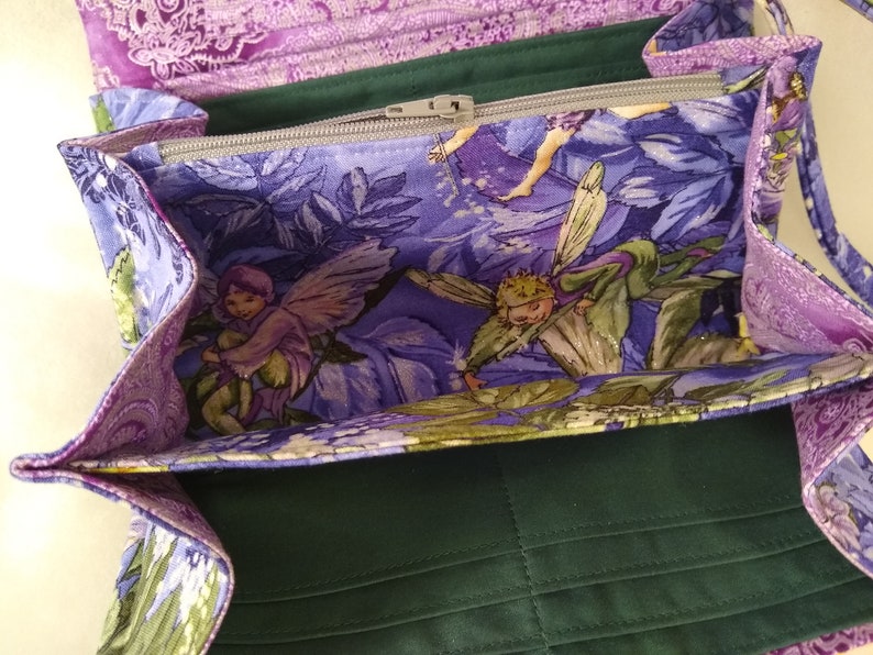 Magical Fairies adorn this accordionexpandable wallet!