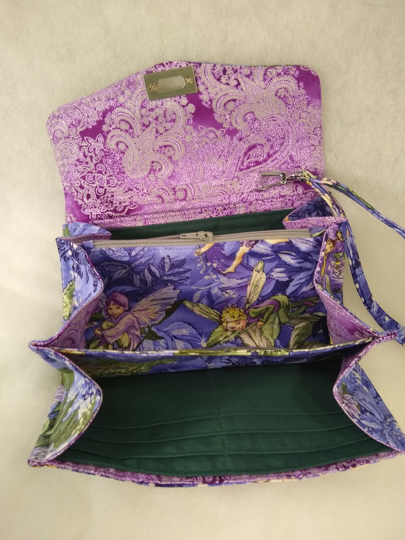 Magical Fairies adorn this accordionexpandable wallet!
