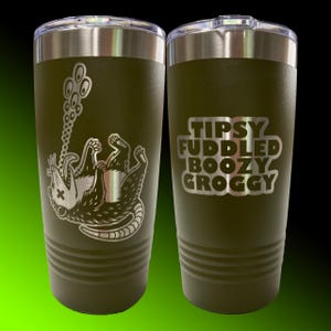 May include: Two olive green stainless steel tumblers with silver lids. One tumbler features a graphic of a possum hanging upside down. The other tumbler has the words "TIPSY FUDDLED BOOZY GROGGY" in silver lettering.