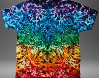 May include: A tie-dye t-shirt with a vibrant rainbow pattern. The shirt transitions from red at the bottom to orange, yellow, green, blue, and purple at the top. The design features a symmetrical, radial pattern.