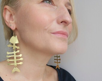 Long statement fishbone earrings made of brass