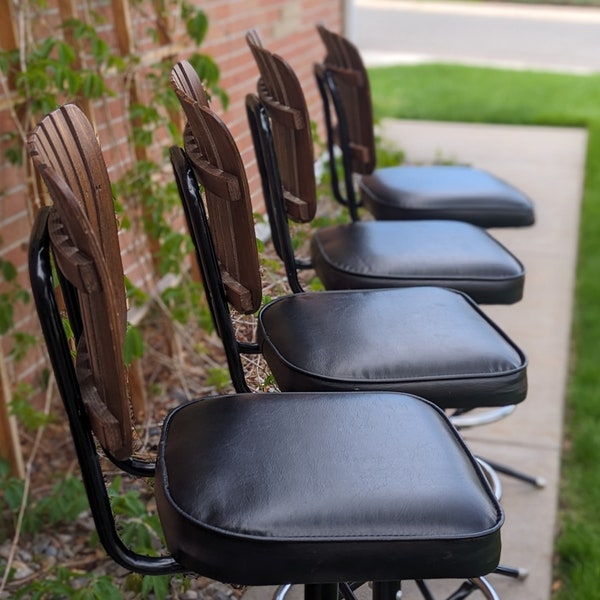 Vintage Mid-Century Modern Set of 4 MCM Atomic Swivel Barstools Wood Slat Back Backrest Black Metal Frame Chrome Footrest Black Vinyl Seats