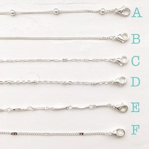 May include: Six different silver chains with clasps, labeled A through F.