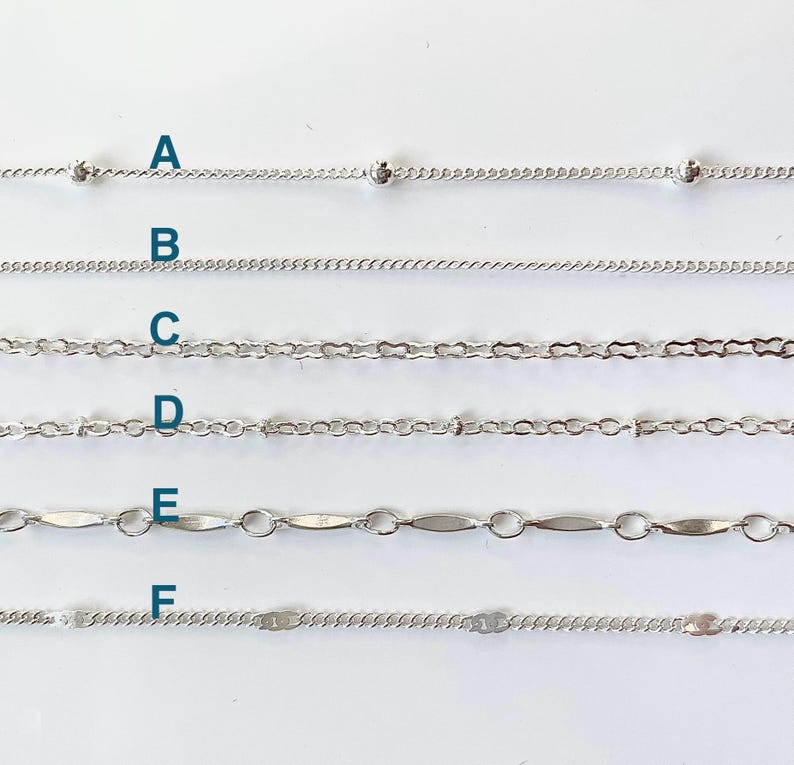 May include: Six different types of silver chains, labeled A through F, are displayed on a white background. The chains are all approximately the same length and are arranged in a vertical row.