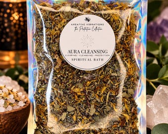 May include: A holographic pouch filled with a dried herbal blend for a spiritual bath. A circular white label on the front reads: Kreative Vibrations, The Protection Collection, Aura Cleansing, Clearing, Cleansing, Protection, Spiritual Bath.