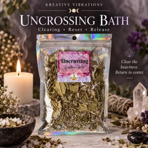 May include: A clear, iridescent pouch filled with dried herbs and salt, labeled Uncrossing Spiritual Bath. The label features a pink and purple crystal background. The pouch is centered, containing a mixture of green leaves and white salt crystals.