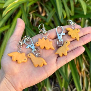 Dino Nuggie Keychain: Handmade Polymer Clay Dinosaur Bag Charm