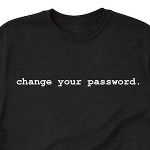 May include: Black t-shirt with the text "change your password." printed in white.