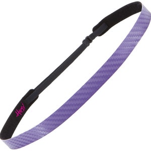 May include: Purple headband with a carbon fiber pattern and black padding. The headband has the word "Hipsy" printed on it in pink.