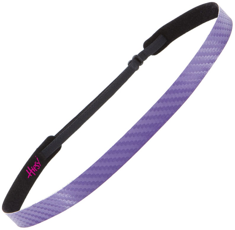 May include: Purple headband with a carbon fiber pattern and black padding. The headband has the word "Hipsy" printed on it in pink.