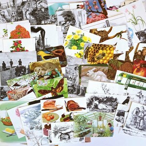 May include: A collection of vintage postcards featuring a variety of images, including nature scenes, animals, and abstract designs. The postcards are in various colors and sizes, and some have handwritten messages on the back.