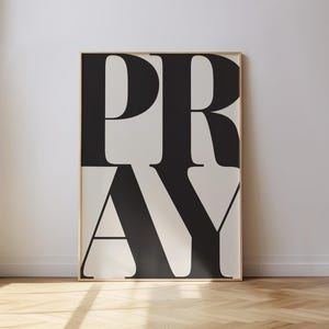 PRAY typography wall art print styled in a light, bright gallery wall