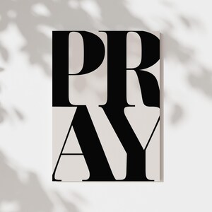 Close up of black and white PRAY scripture typography print digital download