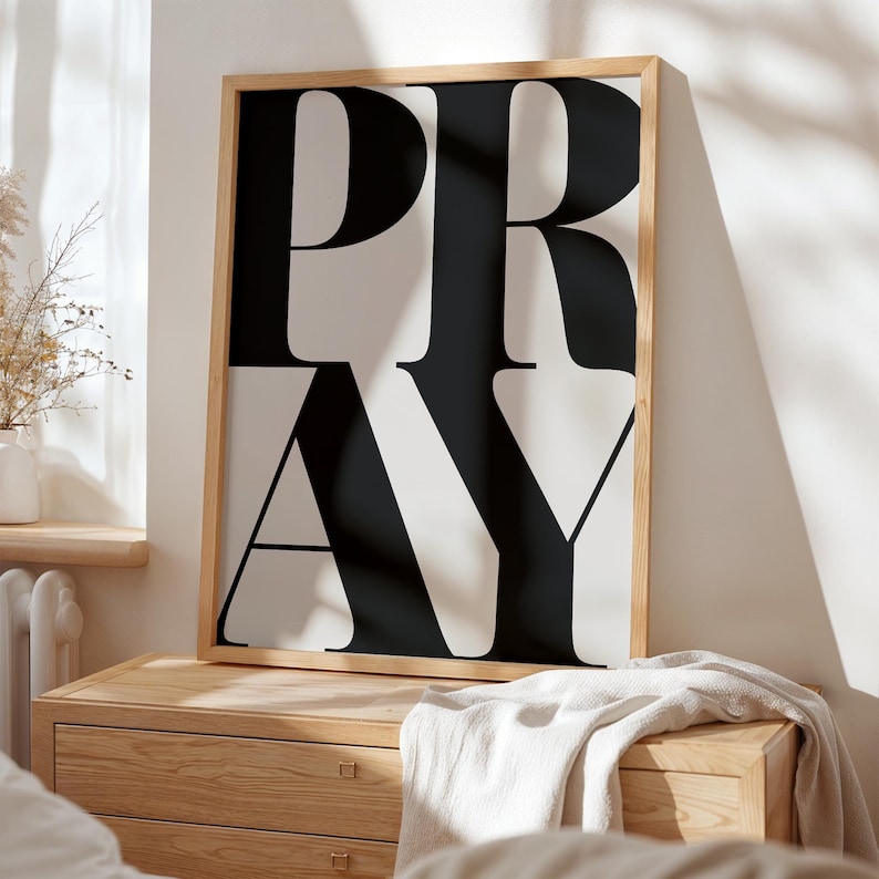 Minimalist Christian prayer wall art styled in modern neutral home interior.