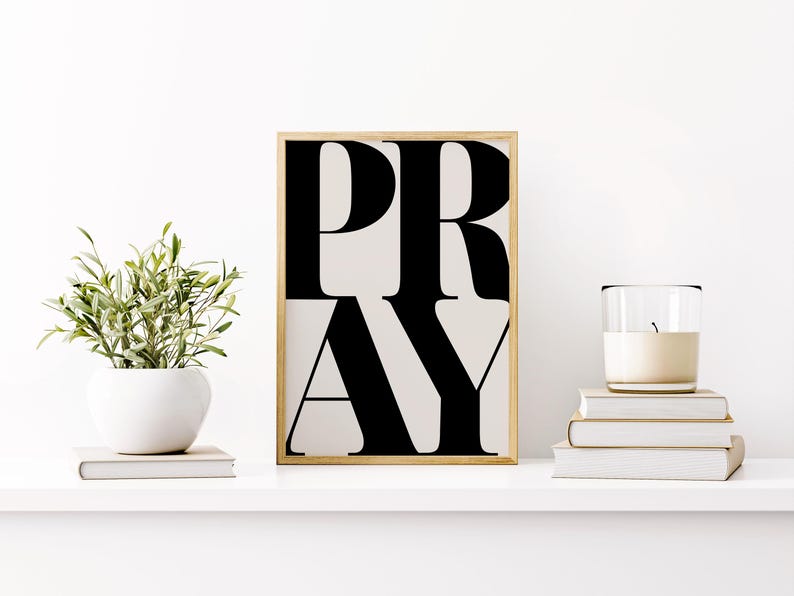 Black and white faith wall art printable displayed in Christian prayer space on a shelf with books, a candle and a plant. Perfect dorm room poster for christian teens, teenagers bedroom artwork.