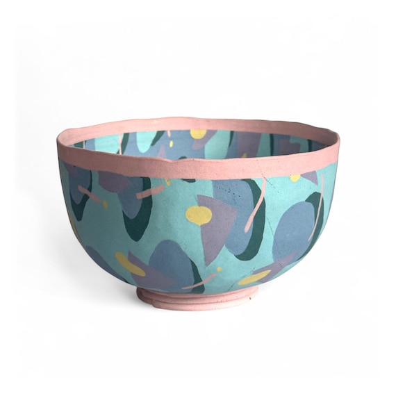 A signed 1985 Carolyn Brice Brooks footed ceramic bowl in the Memphis postmodern style — a named artist, a specific date, a documented movement: this is actual art history you can put on a table.