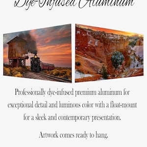May include: Two dye-infused aluminum artworks. One features a steam train near a water tower at sunset. The other depicts a canyon landscape at sunset. Text reads "Dye-Infused Aluminum" and "Artwork comes ready to hang."