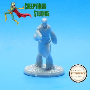 May include: A blue and white painted miniature figure of a humanoid creature with a long robe and a staff. The figure is standing on a round base. The figure is a miniature for a tabletop role-playing game.