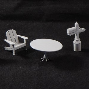 May include: A set of five white miniature outdoor furniture and decor pieces, including a grill, a chair, a table, a mailbox, and a trash can.