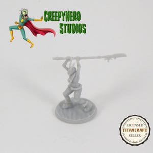 May include: A gray, unpainted miniature figurine of a humanoid figure holding a staff above their head. The figure is standing on a round base. The miniature is a tabletop role-playing game piece.
