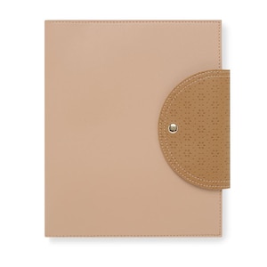 May include: A light brown leather folder with a smaller, textured, brown leather flap on the right side. The flap has a gold button.