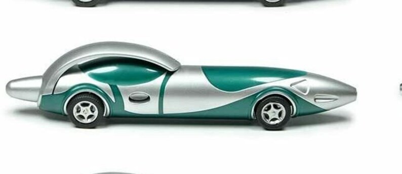 May include: A teal and silver toy car with a streamlined design. The car has a rounded front end and a long, narrow body.