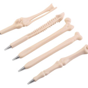 May include: Five bone-shaped pens in various styles, including a ribcage, spine, and femur. The pens are all made of a light beige plastic and have a realistic bone texture.