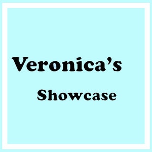 May include: A light blue square with a white border features the text "Veronica's Showcase" in bold black font. The text is centered on the light blue background.