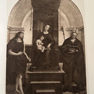 May include: A sepia-toned print of a religious scene. The central figure is a woman holding a baby, seated on a throne. Two figures flank her, one holding a staff and the other pointing. The text "SALVE MATER CHRISTI" is visible.