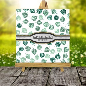 May include: A digital paper with a repeating pattern of green leaves on a white background. The text "PAPER ELEMENT ON ETSY" is on a black and white ribbon.