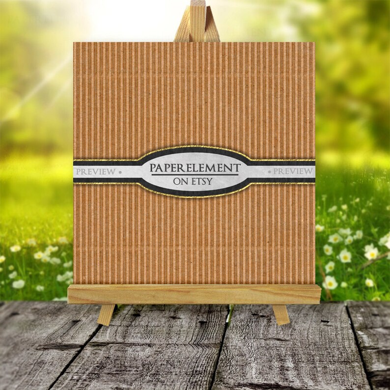 May include: A brown corrugated cardboard paper texture with a silver and black oval label that says "PAPER ELEMENT ON ETSY" with a white ribbon that says "PREVIEW" on either side of the label. The cardboard is on a wooden easel.