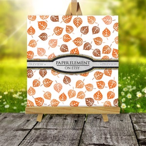 May include: A digital paper with a repeating pattern of orange and brown leaves on a white background. The text "PAPER ELEMENT ON ETSY" is displayed on a black and gold banner.