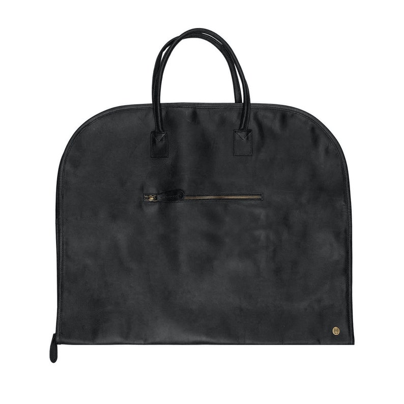 May include: Black leather garment bag with a zippered pocket and two handles.