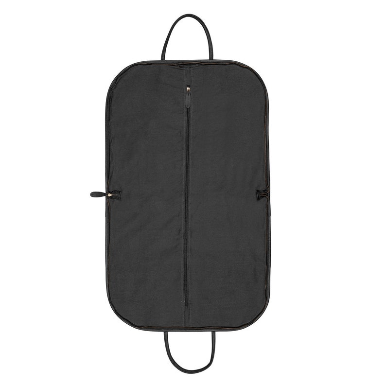 May include: A black garment bag with a zipper closure and a top handle. The bag is made of a durable fabric and is designed to protect clothing while traveling.